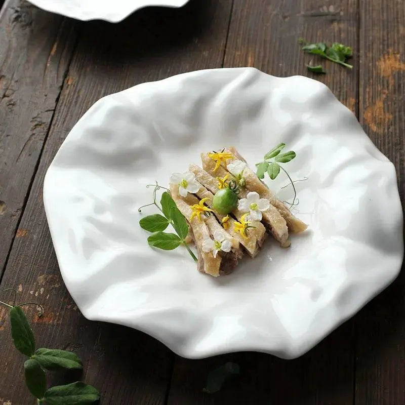 Elegant White Ceramic Plate - Unique Design | Versatile & Easy-Clean, showcasing a modern wavy pattern perfect for stylish food presentation.