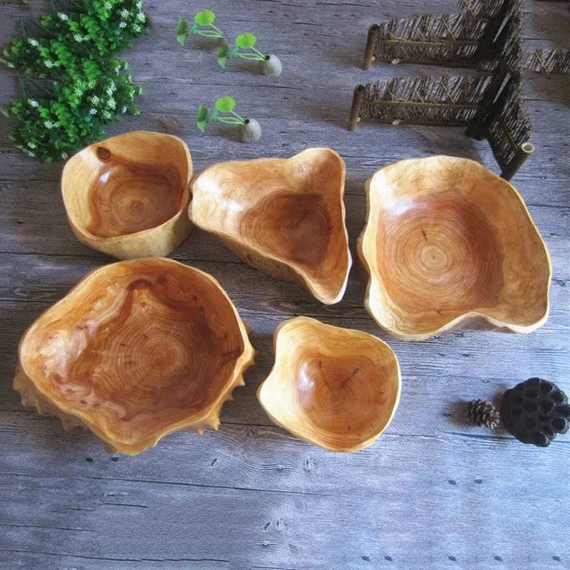 Set of five Wooden Snack Bowls with unique organic shapes, perfect for stylish organizing and serving, displayed on rustic wooden surface.