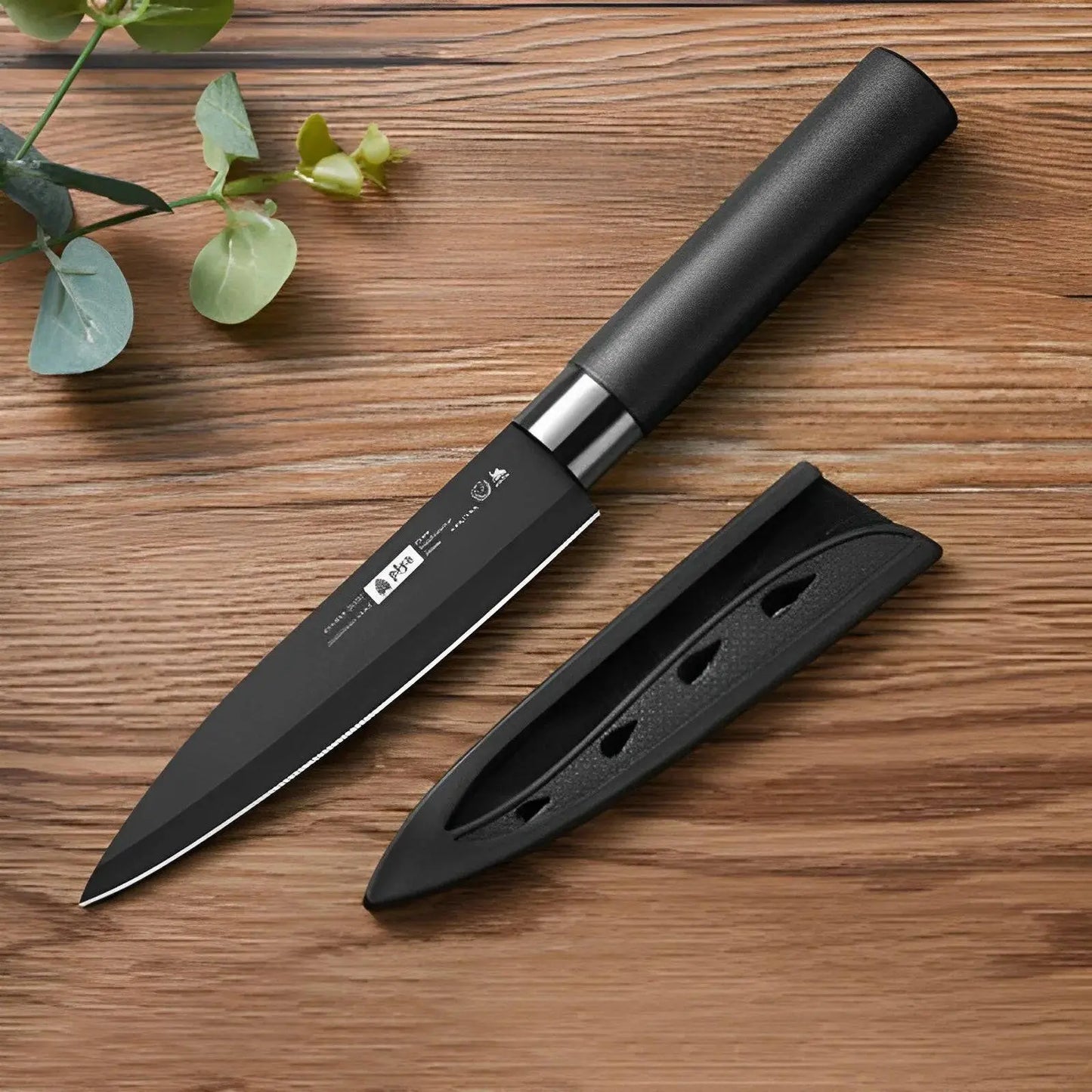 Single Chef's Fruit Knife with black stainless steel blade and sheath, designed for precise fruit slicing and sushi preparation.