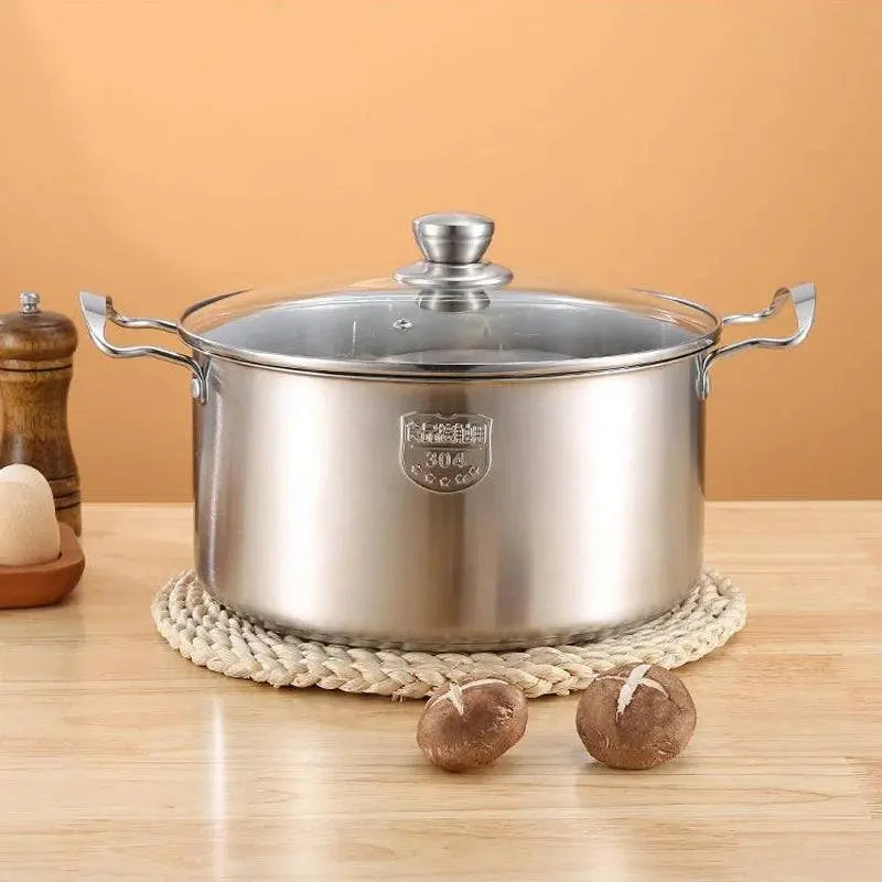 High-grade Stock Pots - Stainless Steel | Durable, Non-stick placed on woven mat with mushrooms, highlighting polished finish and robust build.
