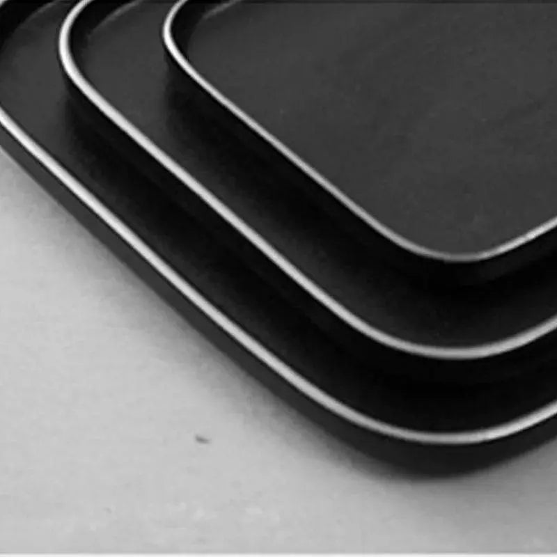 3 Size Black Dishes Set - Modern Dining Essentials stacked to show three matte black plates with subtle silver rims, perfect for versatile table settings.