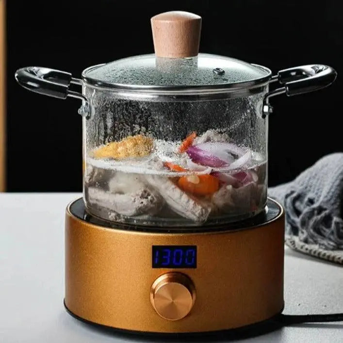 Transparent Glass Soup Pot - Heat-Resistant Cookware shown cooking vegetables and meat on an electric stove, perfect for safe and stylish cooking.