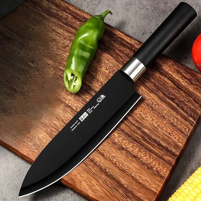 Chef's Fruit Knife with black stainless steel blade on a wooden cutting board, perfect for precision slicing and kitchen versatility.
