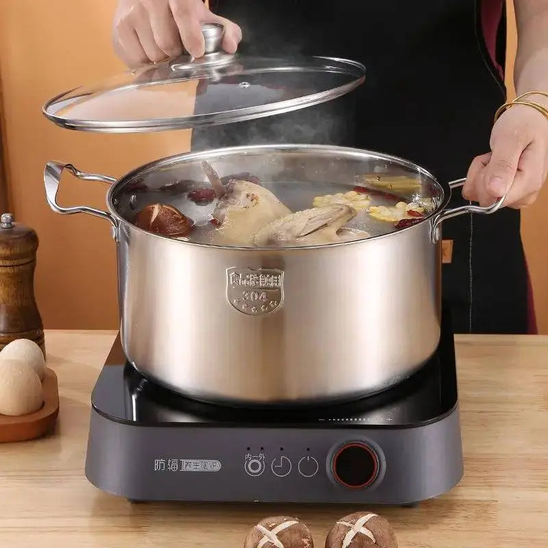 High-grade Stock Pots - Stainless Steel | Durable, Non-stick used for cooking soup on induction cooker, featuring ergonomic handles and glass lid.