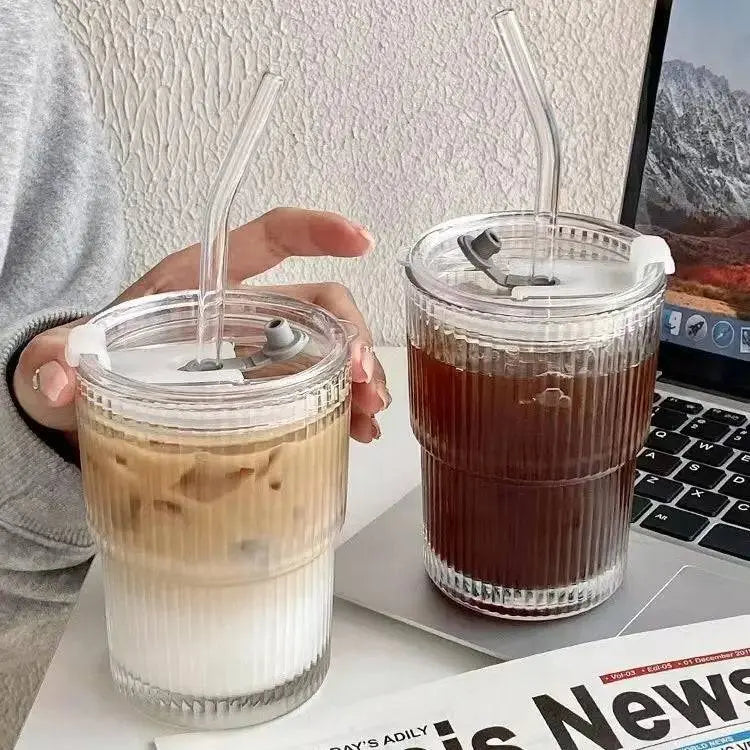 400 ML Stripe Glass Cup | Durable Transparent Design displayed with iced coffee and black coffee, featuring clear lids and reusable glass straws.