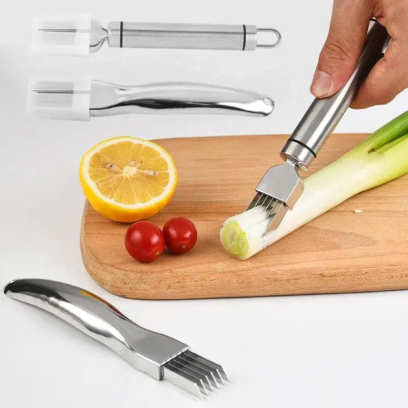 Stainless Steel Onion Cutter - Precision Grater | Quick Meal Prep tool slicing green onions on a wooden board with lemon and tomatoes nearby.