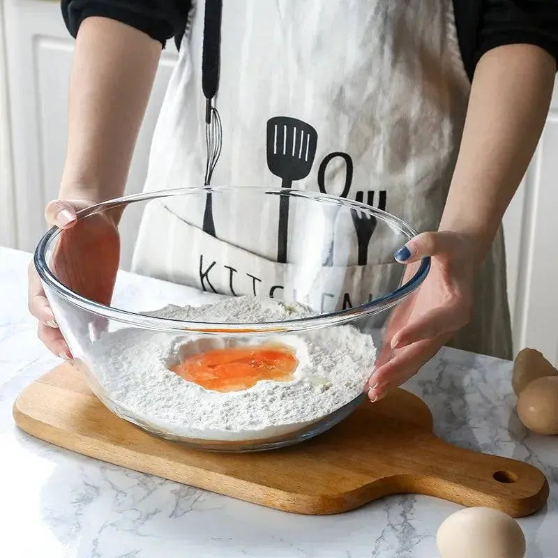 Transparent Glass Salad Bowl - Durable & Versatile Kitchen Essential with flour and egg mixture, perfect for baking preparation.