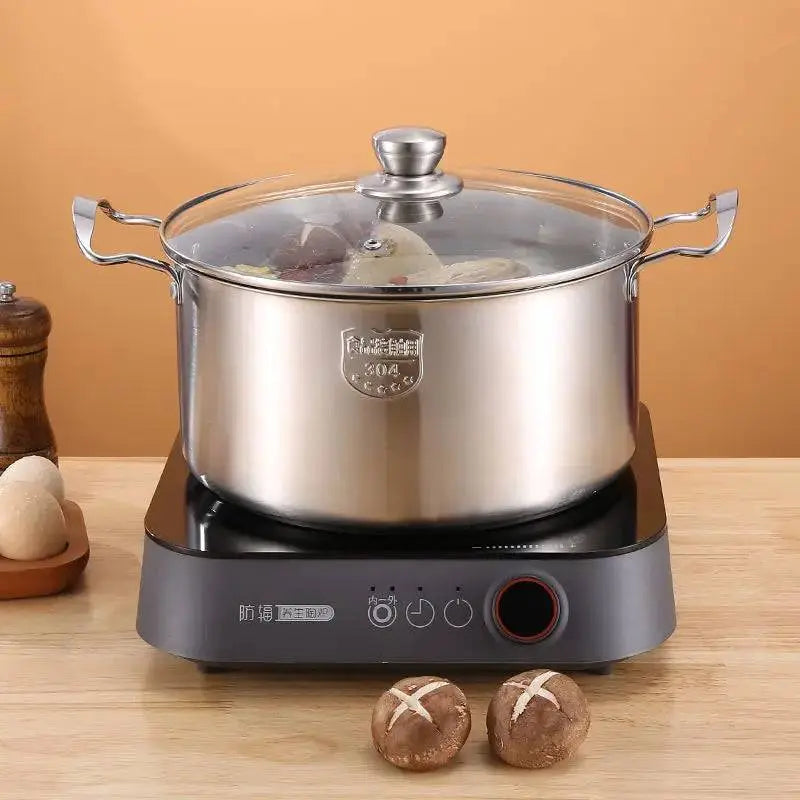 High-grade Stock Pots - Stainless Steel | Durable, Non-stick simmering on induction stove, showcasing clear glass lid and sturdy side handles.