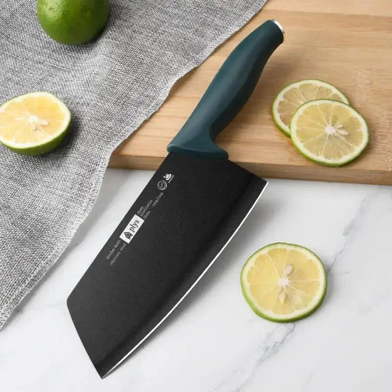 Ladies Cutting Knife - Kitchen Essential with black blade and green handle, slicing limes on a marble surface for culinary precision.
