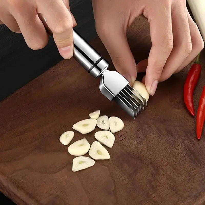 Stainless Steel Onion Cutter - Precision Grater | Quick Meal Prep tool slicing garlic cloves on a wooden board for fast and uniform cuts.