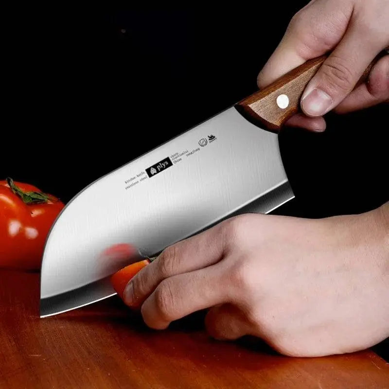 Ladies Cutting Knife - Kitchen Essential with ergonomic wooden handle, slicing tomatoes smoothly for efficient meal preparation.