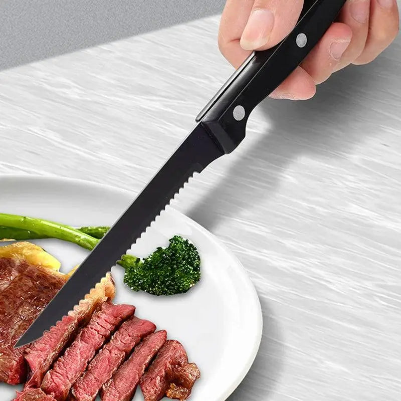 24 Pieces Stainless Steel Cutlery Set | Durable Dining Elegance showing a serrated steak knife cutting through juicy steak on a white plate.