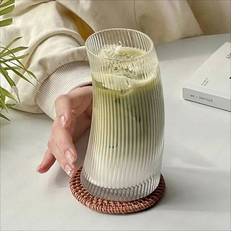 Transparent Graceful Glass Cup with stylish ribbed design, filled with iced matcha latte, microwave and dishwasher safe for modern kitchens.