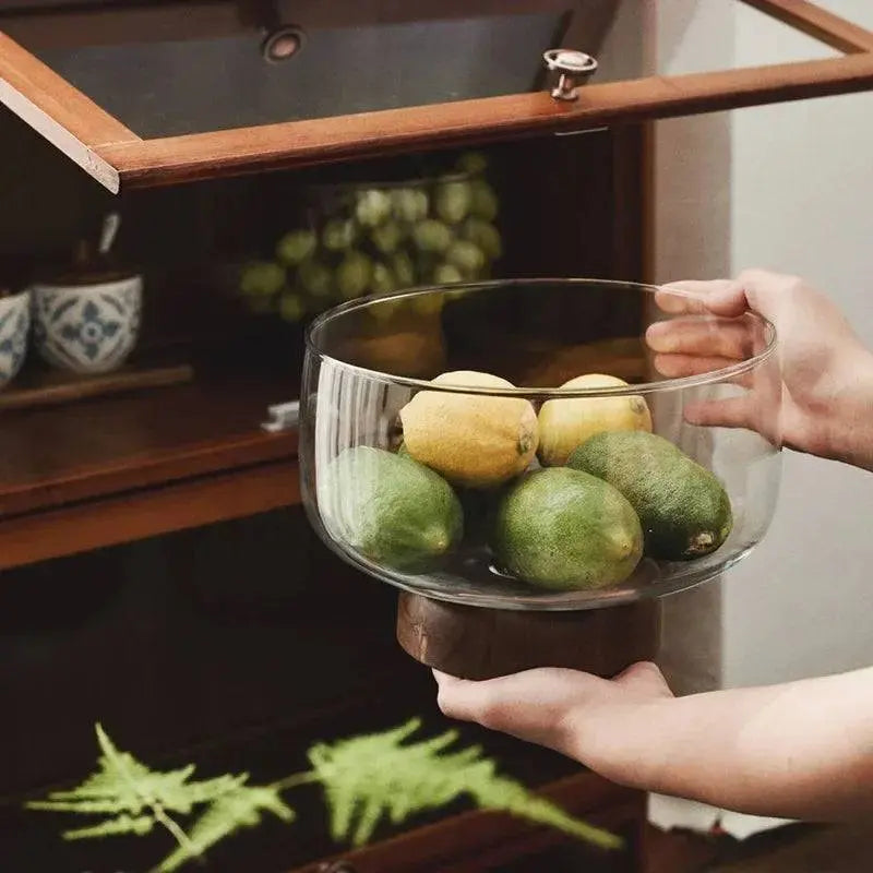 Acacia Wood Fruit Plate - Japanese Style being placed in a cabinet, highlighting its versatile storage and decorative appeal.