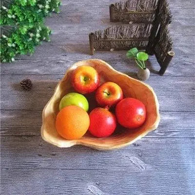 Wooden Snack Bowl with assorted fruits, featuring a unique organic shape and natural wood texture for stylish kitchen organization.