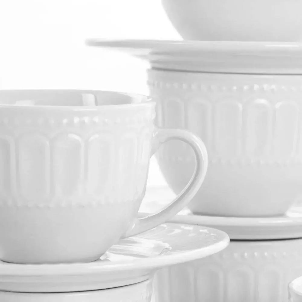 Charlotte Mug Set - Stylish & Durable Mugs | Microwave Safe, close-up of white embossed mugs and saucers highlighting the elegant textured design.
