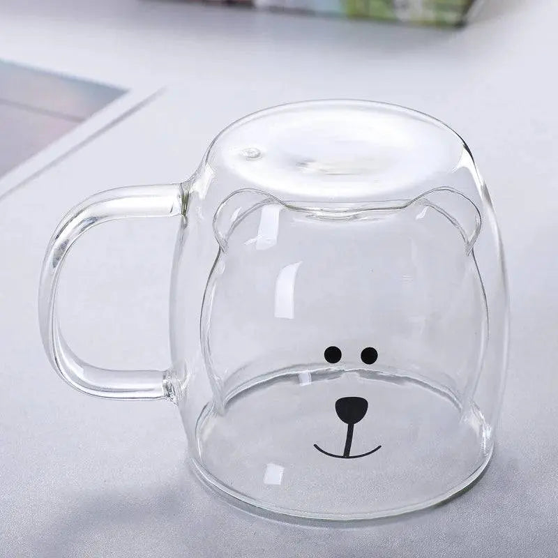 Borosilicate Glass Cup - Elevate Sipping | Spill-Resistant upside down showing a clear bear face design, emphasizing its playful and durable craftsmanship.