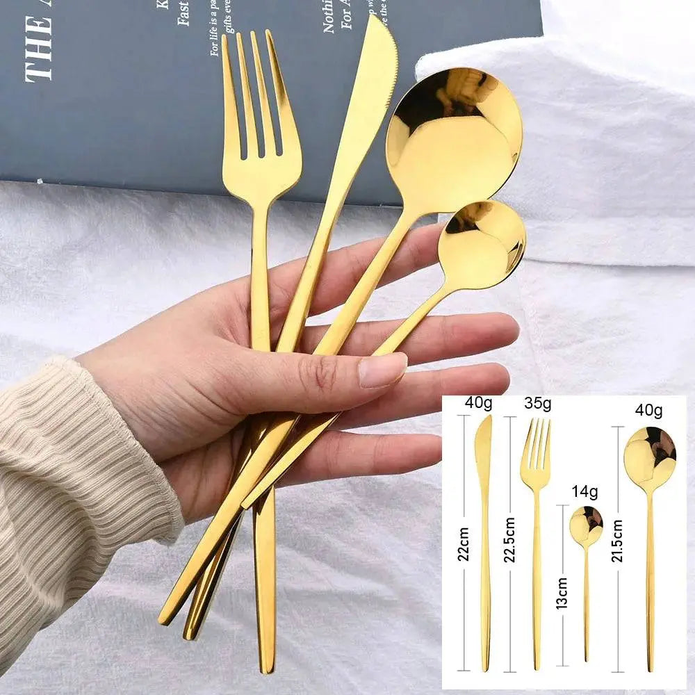 24 Pcs Black Handle Golden Cutlery Set featuring sleek gold stainless steel fork, knife, spoon, and teaspoon, ideal for elegant dining experiences.
