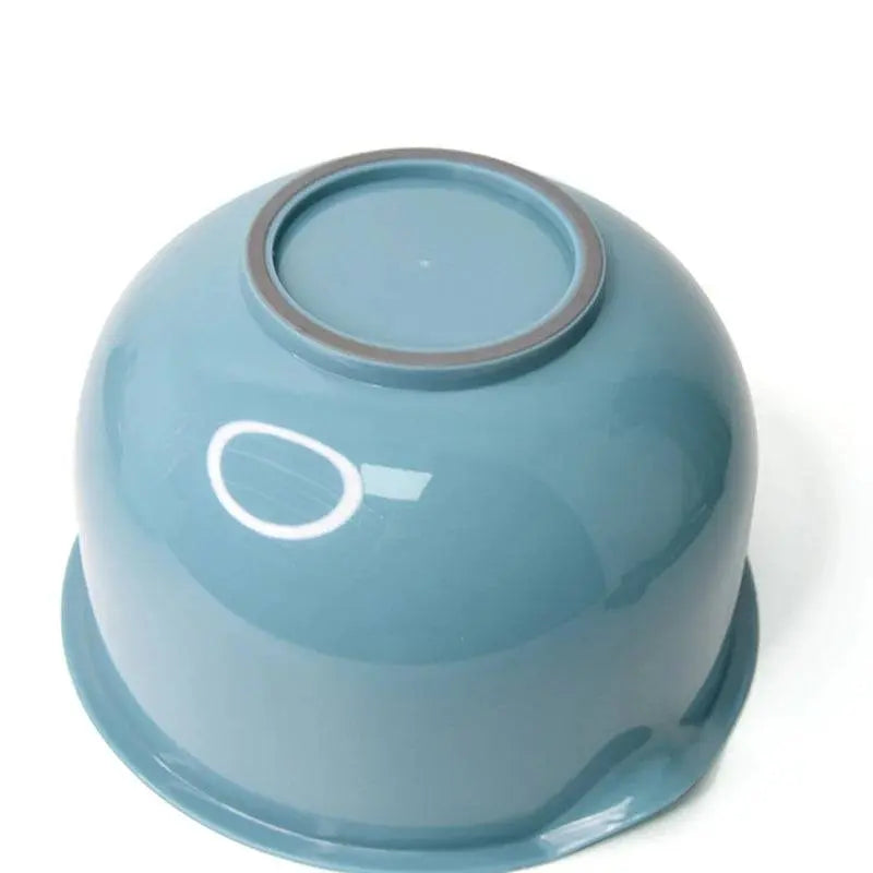 Bottom view of teal Multipurpose Plastic Mixing Bowl, featuring a non-slip base for stable and safe food preparation.