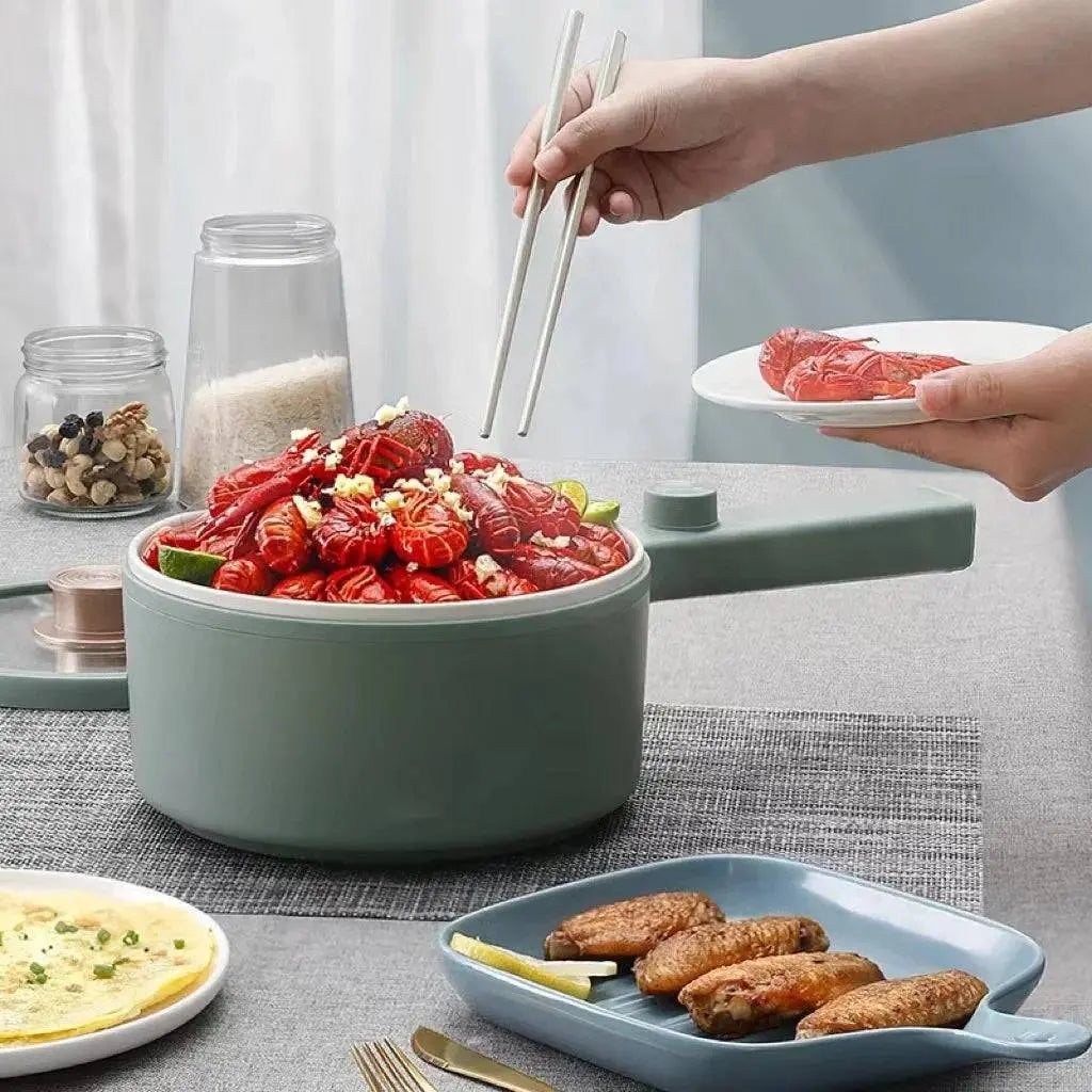Electric Hot Pot Cooker - Hassle-Free Cooking | Portable 1.5L filled with cooked seafood, ideal for versatile kitchen use.