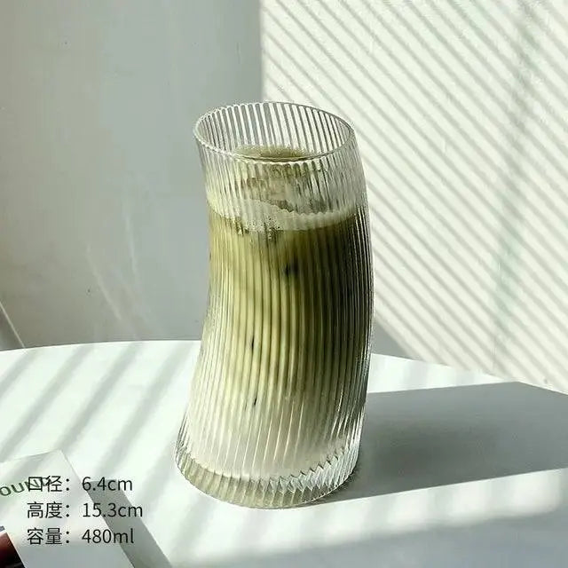 Transparent Graceful Glass Cup tall version, 480ml capacity, ribbed design filled with iced matcha latte, microwave and dishwasher safe.