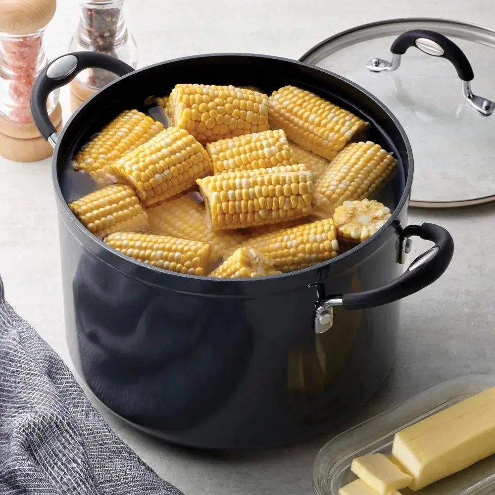 Tramontina 8 Qt Non-Stick Stock Pot filled with corn on the cob, showcasing its large capacity and easy cleanup design.