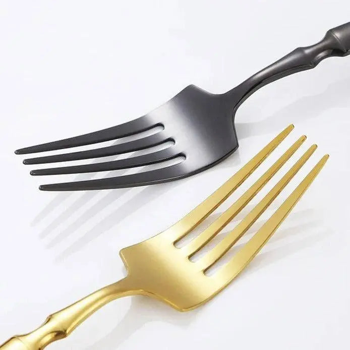 Comparison of gold and black forks from the 5/20/30 Pieces Cutlery - Gold Stainless Steel Set, emphasizing stylish, durable finishes for modern dining.