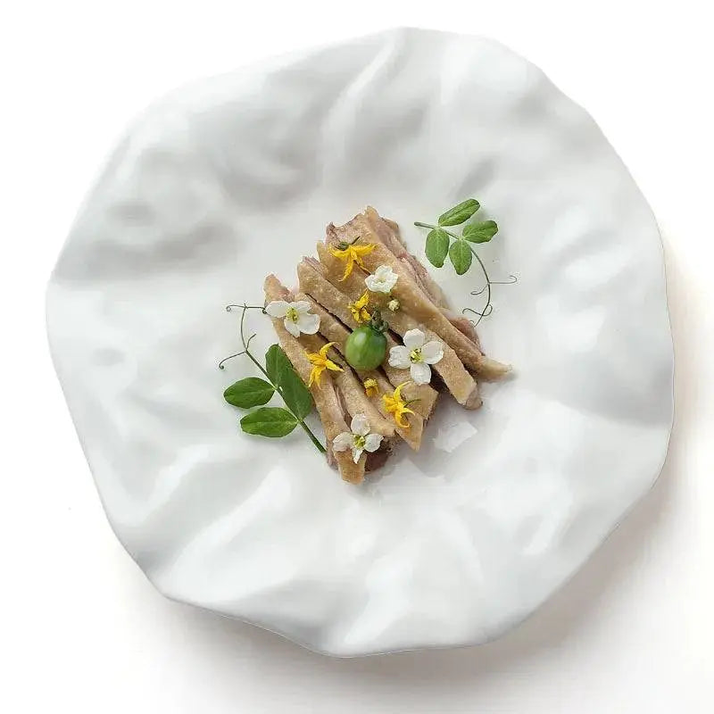 Top view of White Ceramic Plate - Unique Design | Versatile & Easy-Clean, featuring a minimalist wavy design perfect for modern table settings.