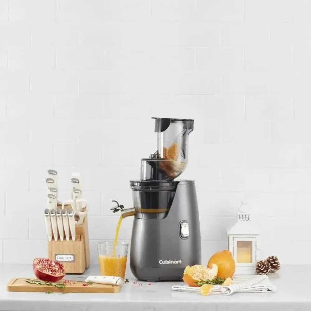 Easy Clean Slow Juicer - Effortless Juicing | Max Nutrition, shown juicing oranges with a sleek design, ideal for compact kitchen spaces.