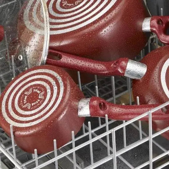 Easy Care Cookware Set - 12 Piece Non-Stick | Durable red pots and pans with non-stick coating placed in a dishwasher, highlighting easy cleaning.