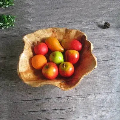 Wooden Snack Bowl filled with colorful fruits, highlighting its unique carved design and functionality for serving or decorating.