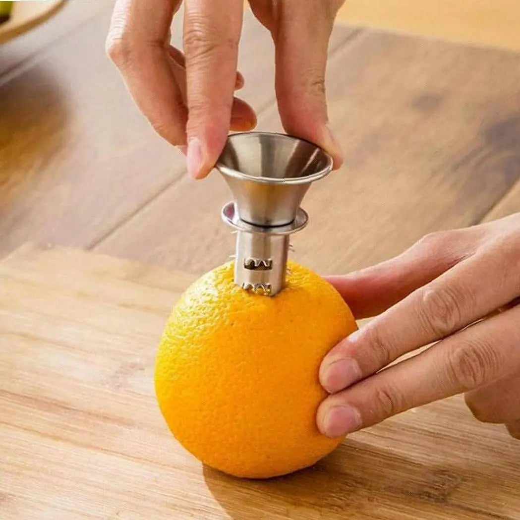 Handheld Lemon Squeezer - Easy Juicing | Durable Design being inserted into an orange, demonstrating simple and efficient setup for quick juice extraction.