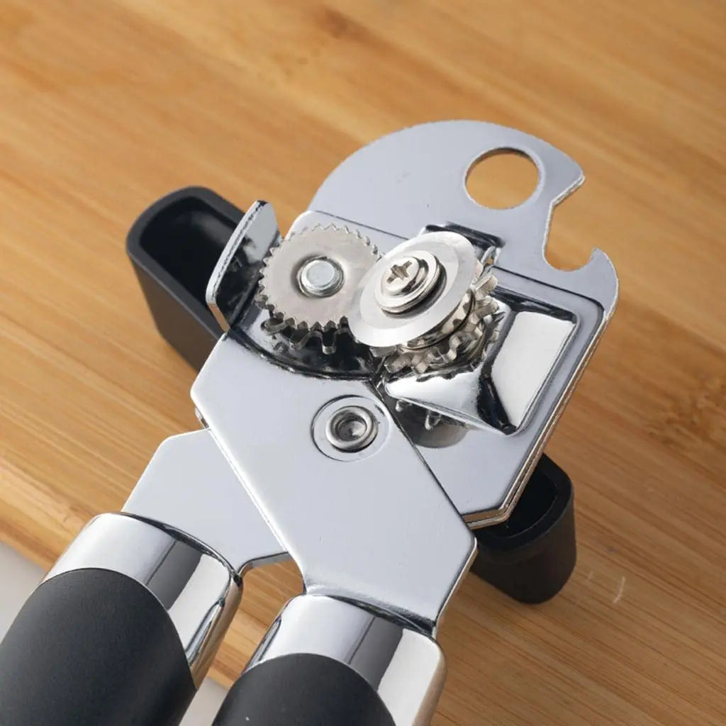 Close-up of Professional Tin Manual Can Opener - Manual Can Opener | Ergonomic, Durable, Multifunctional showing sharp cutting wheel and sturdy build.