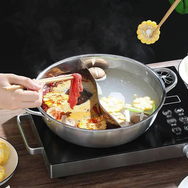 Chinese Hot Pot - Stainless Steel 2-in-1 Cooker shown on an induction stove, with beef and corn being cooked in divided broths for versatile dining.