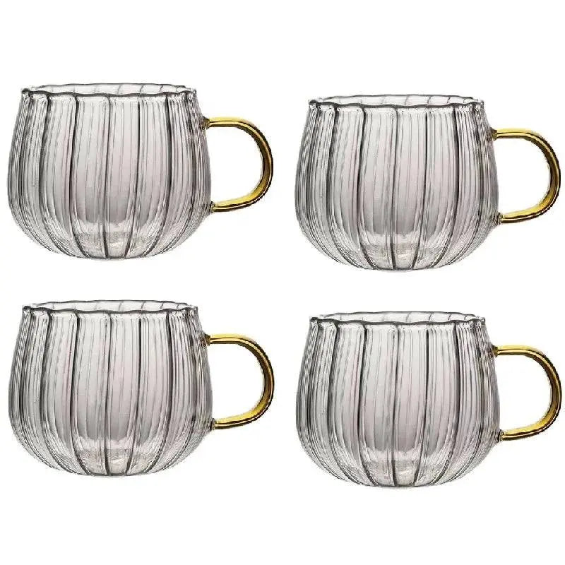 Set of four Heat-Resistant Striped Glass Mugs with gold handles. Premium heat resistant glass mug set for elegant beverage service.