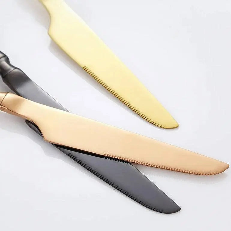 Gold, rose gold, and black knives from the 5/20/30 Pieces Cutlery - Gold Stainless Steel Set, featuring serrated edges for efficient cutting.