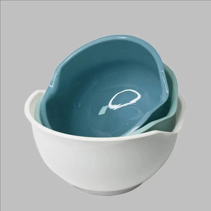 Stacked Multipurpose Plastic Mixing Bowl Set in teal and white colors, showcasing space-saving design for modern kitchens.