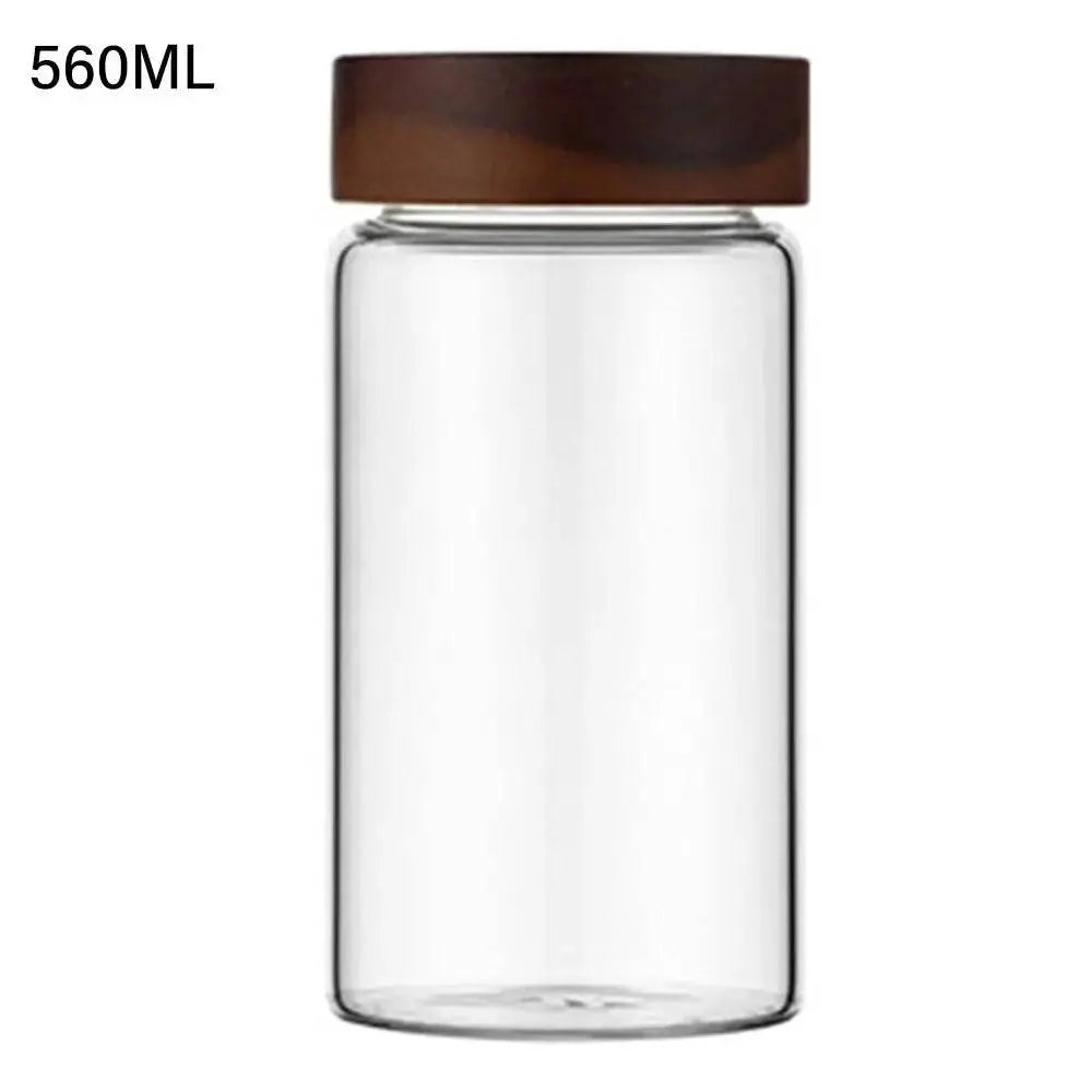 Glass Spice Jars with Wood Lids - Airtight Seal | Buy 2, Get 1 Free displaying a 560ML tall glass spice jar with a secure wooden lid for kitchen storage.