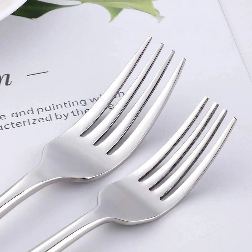 Close-up of dinner forks from the 304 Stainless Steel Dinnerware Set - Timeless Dining, showcasing their elegant and sturdy design.