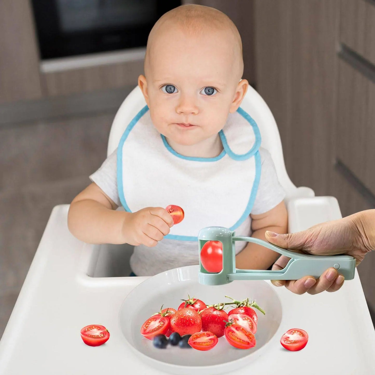 Parent using Handy Grape Cutter - Grape Cutter Tool | Safe Fruit Slicer to prepare toddler-safe sliced tomatoes for a baby.