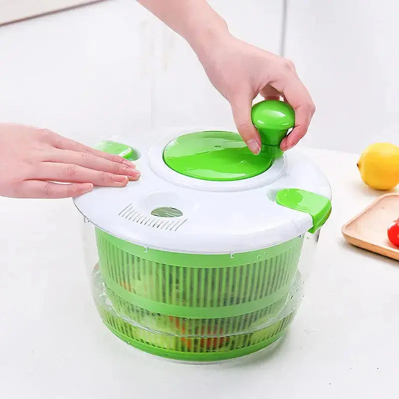 Manual Vegetable Salad Spinner - Compact, Durable | Buy Now, demonstrating hand operation with green knob and fresh vegetables inside.