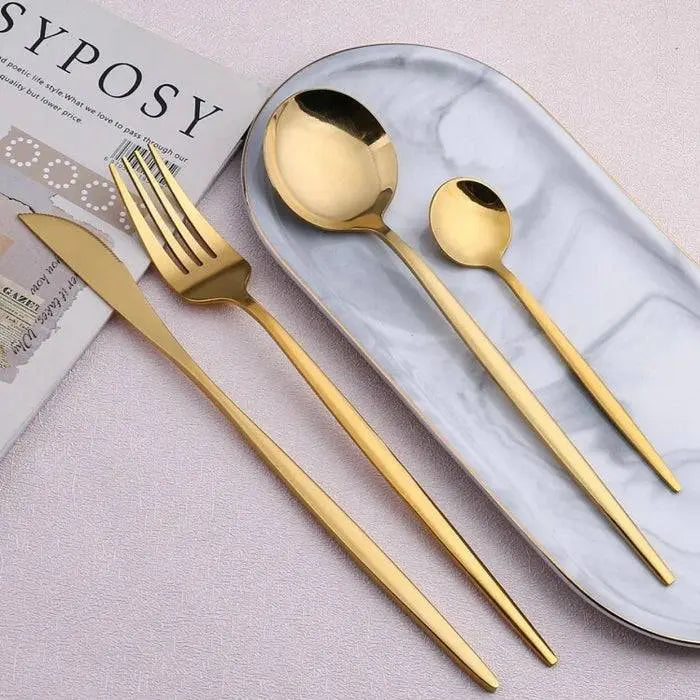 Luxurious 16 Pieces Dinnerware Set with matte gold flatware displayed on a marble tray, ideal for sophisticated table decor.