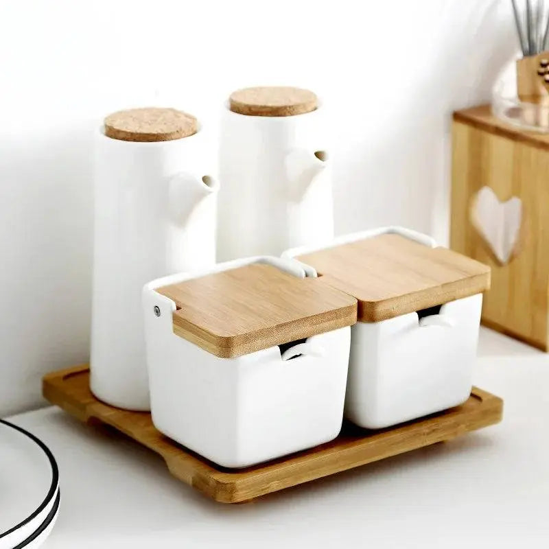 Minimalist Ceramic Spice Jar with Bamboo Lid | Compact & Airtight set featuring two spice jars and two oil dispensers on a bamboo tray.