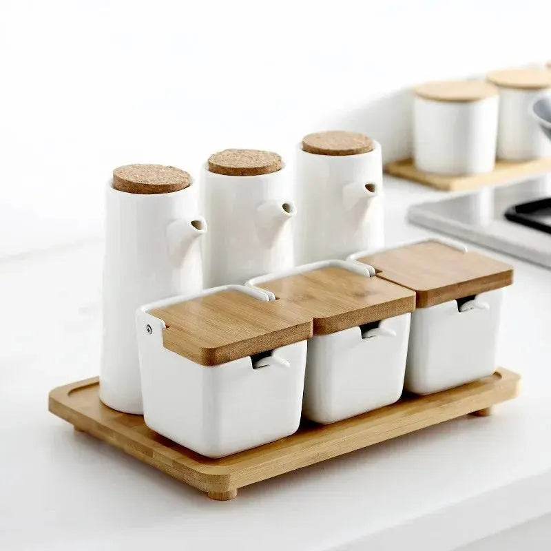 Minimalist Ceramic Spice Jar with Bamboo Lid | Compact & Airtight kitchen setup with spice jars and oil dispensers organized on a bamboo tray.