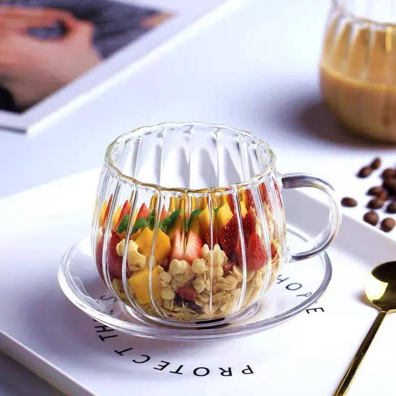 Heat-Resistant Striped Glass Mug filled with granola, strawberries, and mango on a white tray. Elegant heat resistant glass mug perfect for stylish serving.