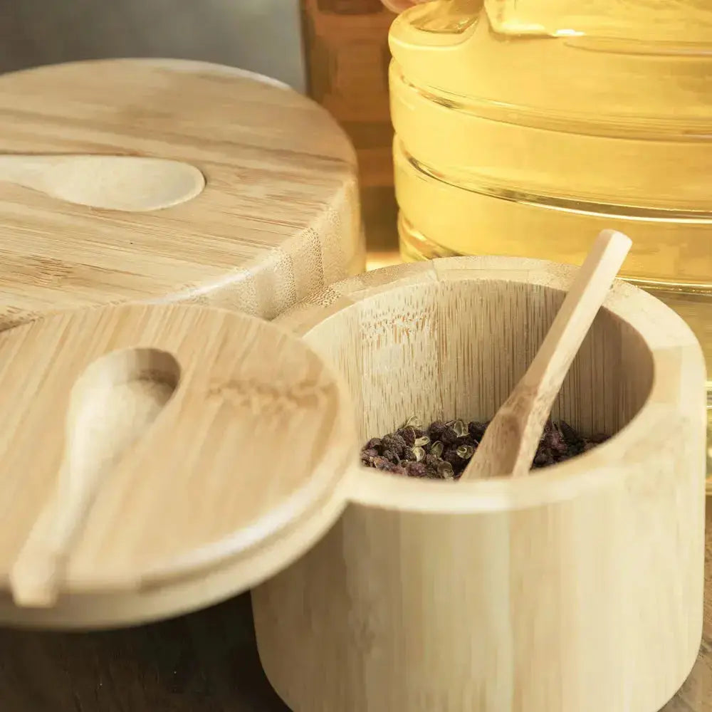 Close-up of Bamboo Spice Container with Magnetic Lid and spoon, storing spices neatly for a tidy, space-saving kitchen.