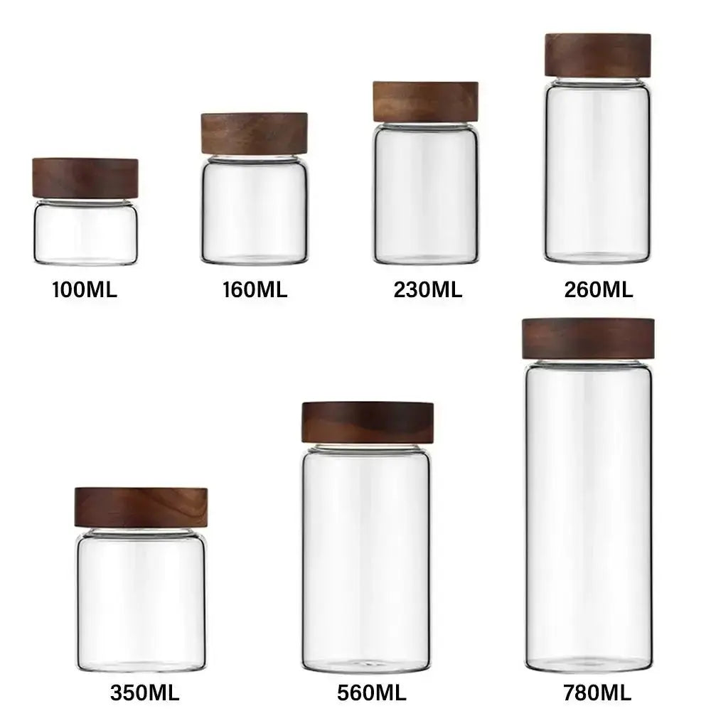 Glass Spice Jars with Wood Lids - Airtight Seal | Buy 2, Get 1 Free showing six different jar sizes from 100ML to 780ML with acacia wood lids.