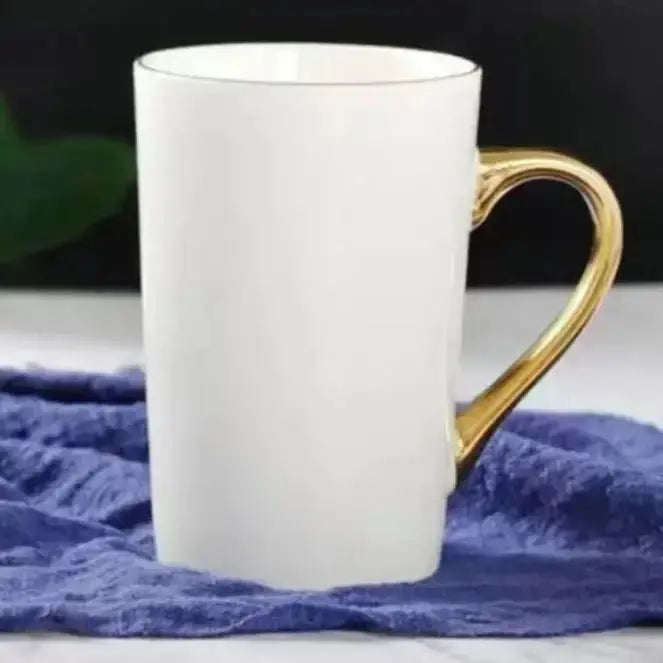 Tall Elegant Coffee Cup with Gold Handle on a blue cloth, offering a sophisticated and elongated design for premium coffee moments.