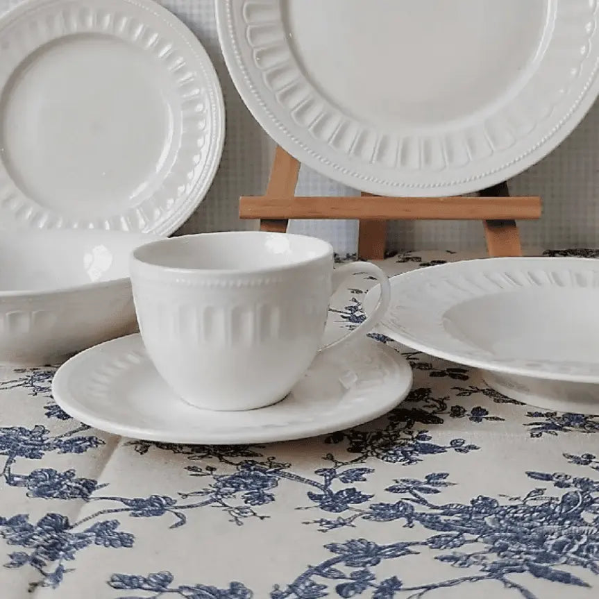 Charlotte Mug Set - Stylish & Durable Mugs | Microwave Safe, displayed with coordinating plates on a blue floral tablecloth for a cohesive dining setup.
