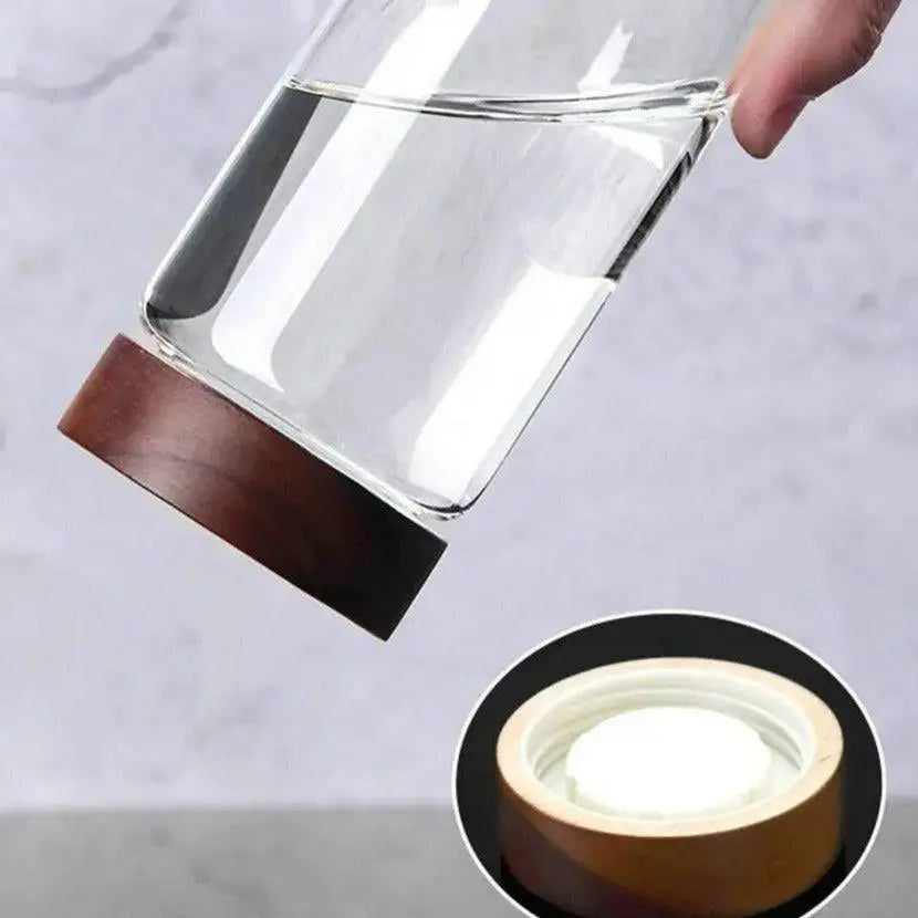 Glass Spice Jars with Wood Lids - Airtight Seal | Buy 2, Get 1 Free demonstrating the leak-proof seal of a jar filled with water held upside down.